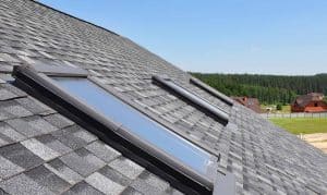 Roof windows and skylights and blue sky