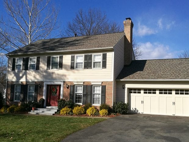 House with new roof by Dominion Roofing Co.