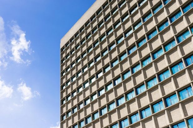 Close-up of office building and blue sky