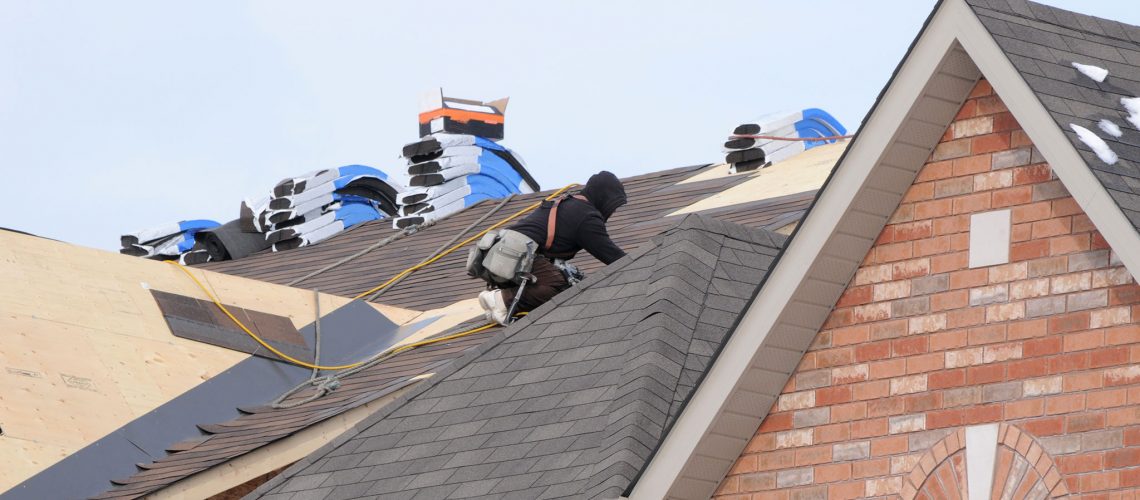 roofer on the job in warm clothing